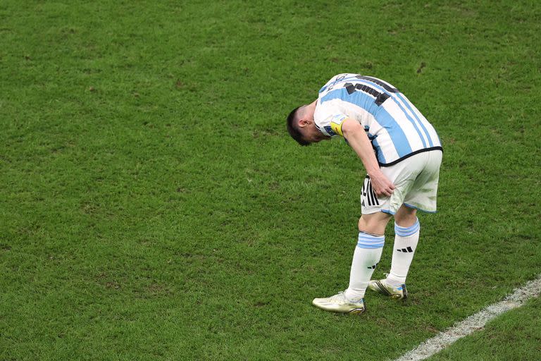 LUSAIL CITY, QATAR - DECEMBER 13: Lionel Messi of Argentina holds his leg as he reacts during the FIFA World Cup Qatar 2022 semi final match between Argentina and Croatia at Lusail Stadium on December 13, 2022 in Lusail City, Qatar. (Photo by Julian Finney/Getty Images)