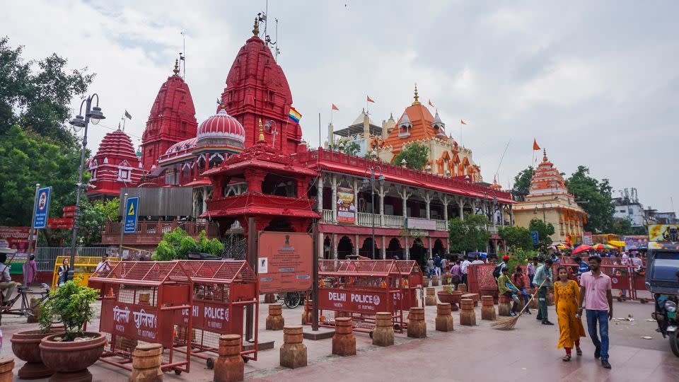 People come from miles away to pray at the Shri Digambar Jain Lal Temple (red) and the Hindu Gauri Shankar Temple (orange) at Chandni Chowk. - Aishwarya S. Iyer/CNN