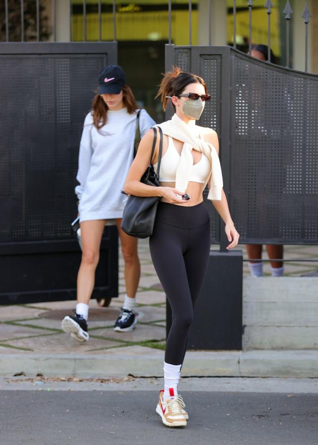 Kendall Jenner Serves Pilates Preppy Vibes in a Sports Bra and Tied Sweater