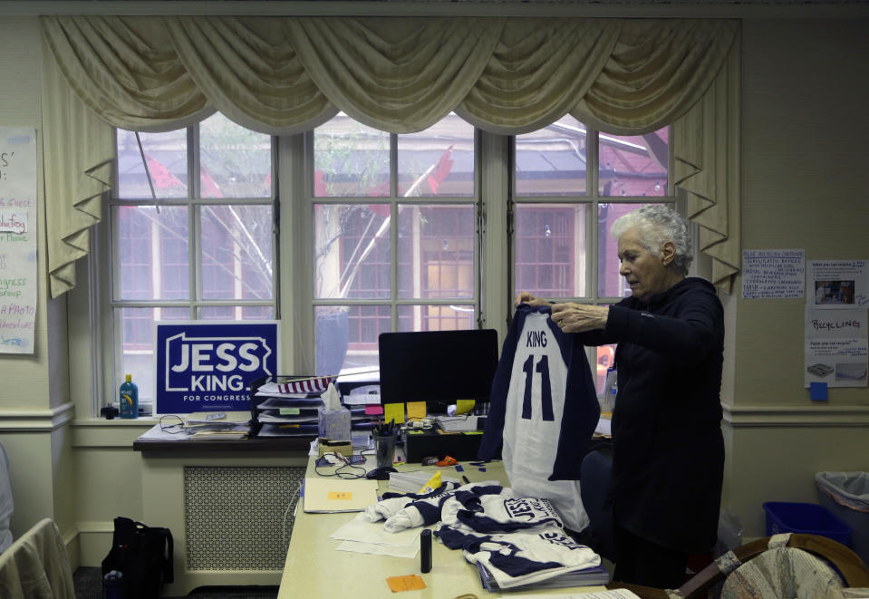 Volunteer Barbara Wank folds merchandise at the headquarters of candidate Jess King, Democratic candidate in Pennsylvania's 11th Congressional District, Friday Nov. 2, 2018, in Lancaster, Pa. Voters in Pennsylvania's rolling dairy farms and Amish countryside had rarely, if ever, seen a Democrat mount a competitive campaign for Congress, until now. From all appearances, first-time candidate Jess King is giving freshman Republican U.S. Rep. Lloyd Smucker a fight to the finish in Tuesday's election in this conservative district. (AP Photo/Jacqueline Larma)