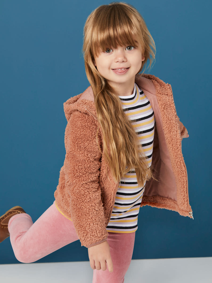 Red-haired child girl wears Best & Less Teddy Bomber jacket $15