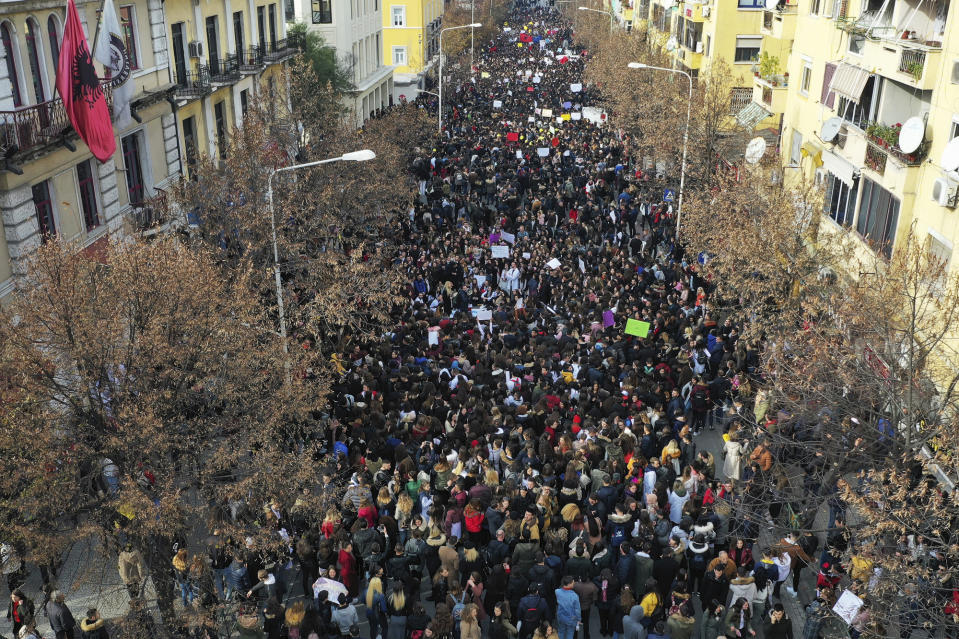 Albania University students protest outside the Education Ministry in Tirana, Tuesday, Dec. 11, 2018. Student demands include cutting tuition fees in half, doubling the budget for education and a greater student presence on decision-making boards.(AP Photo/ Hektor Pustina)