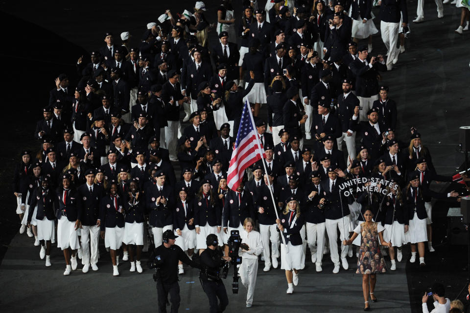 LONDON, ENGLAND - JULY 27: Mariel Zagunis of the United States Olympic fencing team carries her country's flag during the Opening Ceremony of the London 2012 Olympic Games at the Olympic Stadium on July 27, 2012 in London, England. (Photo by Stu Forster/Getty Images)