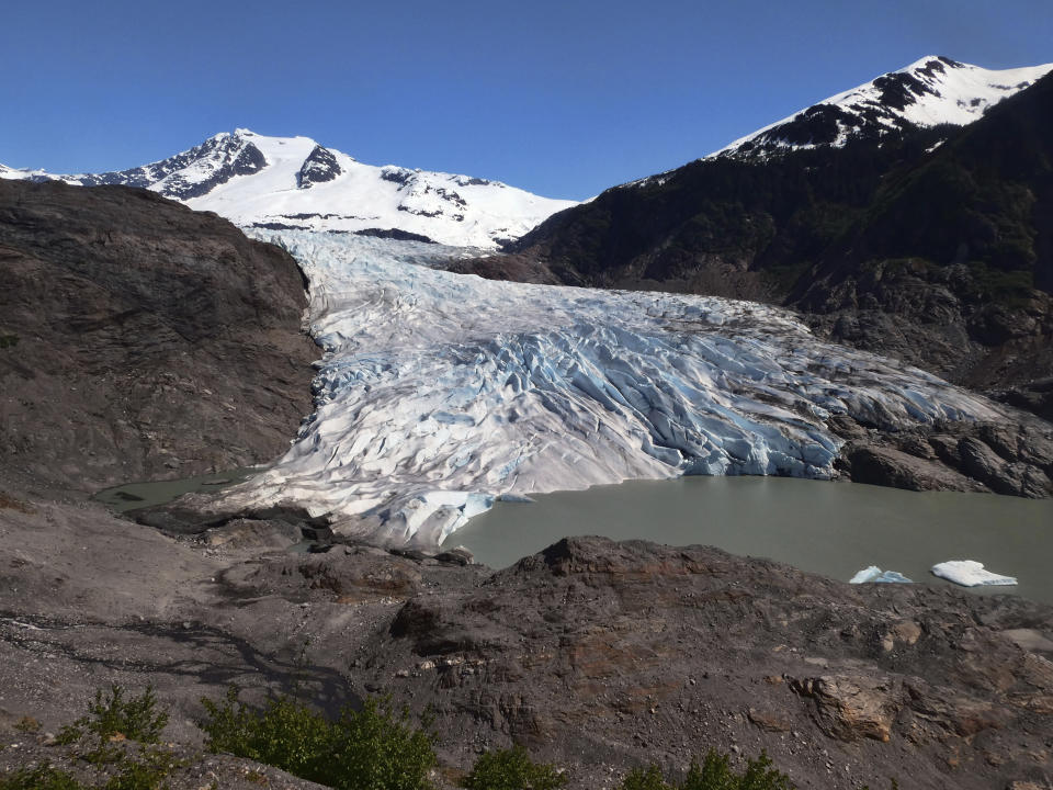 Chunks of ice float on Mendenhall Lake in front of the Mendenhall Glacier.