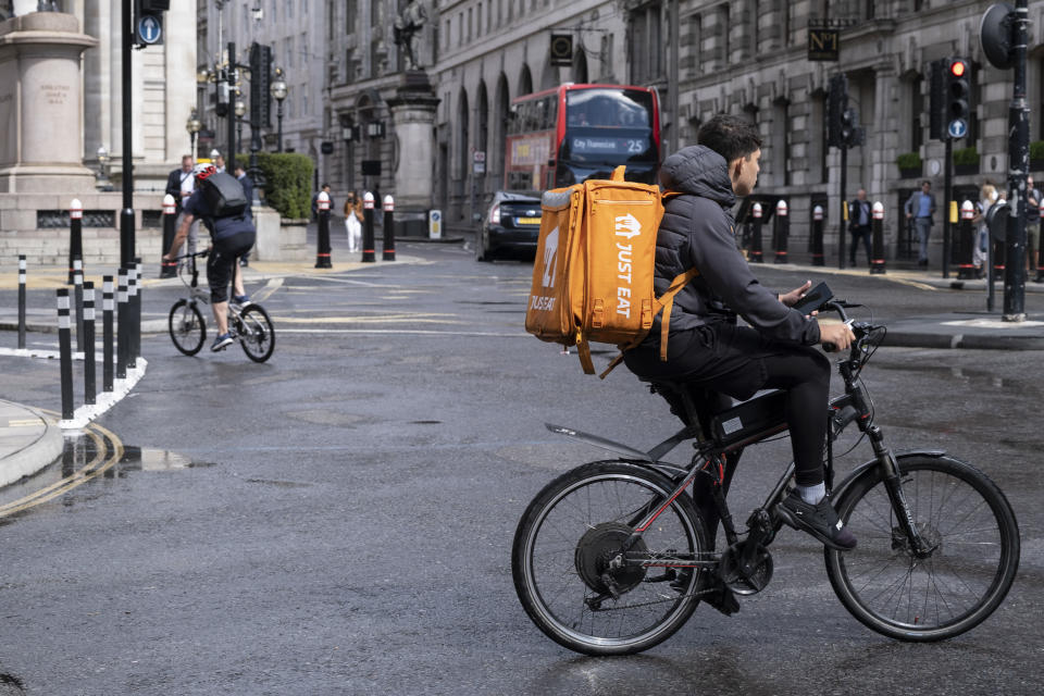 Just Eat cycle courier in the City of London on 27th June 2022 in London, United Kingdom. Just Eat Limited is a British online food order and delivery service founded in 2001 . It acts as an intermediary between independent takeaway food outlets and customers, with thousands of cycle couriers delivering food by bicycle and other forms of transport. Gig workers are independent contractors, online platform workers, contract firm workers, on-call workers and temporary workers. Gig workers enter into formal agreements with on-demand companies to provide services to the companys clients. (photo by Mike Kemp/In Pictures via Getty Images)