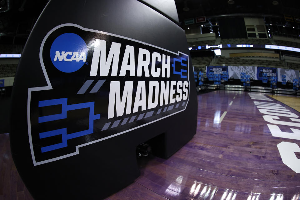 The NCAA March Madness logo is seen on the basket stanchion before a game between Oral Roberts and  Florida during the 2021 NCAA men&#39;s basketball tournament. (Maddie Meyer/Getty Images)