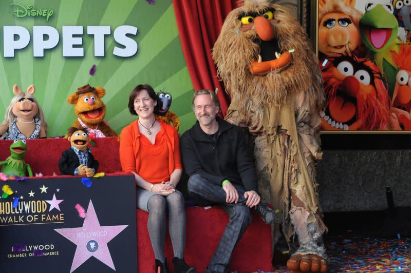 From left, Kermit the Frog, Miss Piggy, Walter, Fozzy, Lisa Henson, Brian Henson and Sweetums unveiled the Muppets' star on the Hollywood Walk of Fame. File Photo by Jim Ruymen/UPI