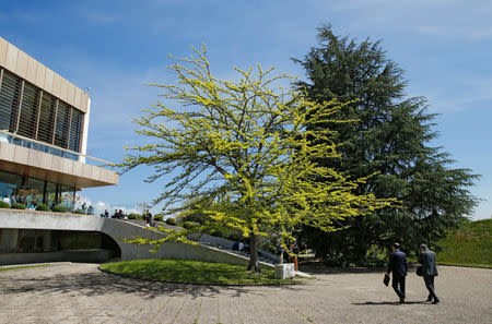 North Korea's ambassador to the United Nations Han Tae Song (2R) walks back into the building with his assistant after an interview with Reuters at the United Nations in Geneva, Switzerland, May 22, 2019. REUTERS/Denis Balibouse