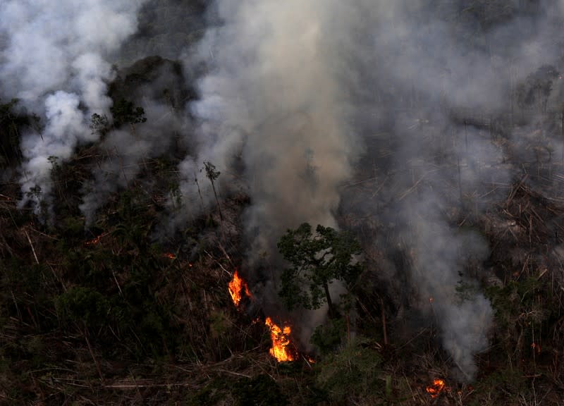 FILE PHOTO: An aerial view of a tract of Amazon jungle burning as it is cleared by farmers in Itaituba