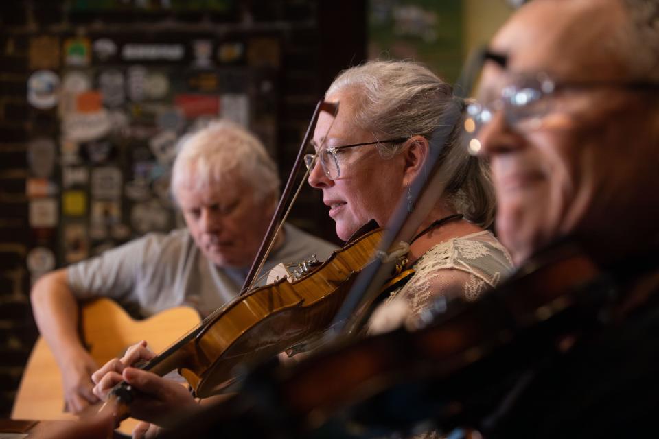 Sarah Pirkle, program director for the Junior Appalachian Musicians of North Knox, plays the fiddle with friends during a weekly Old Time Jam at Jig & Reel on Tuesday, September 19, 2023.