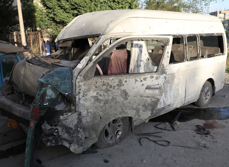 A wreckage of a bus which carried employees of an Afghan television station and was bombed is seen in Kabul