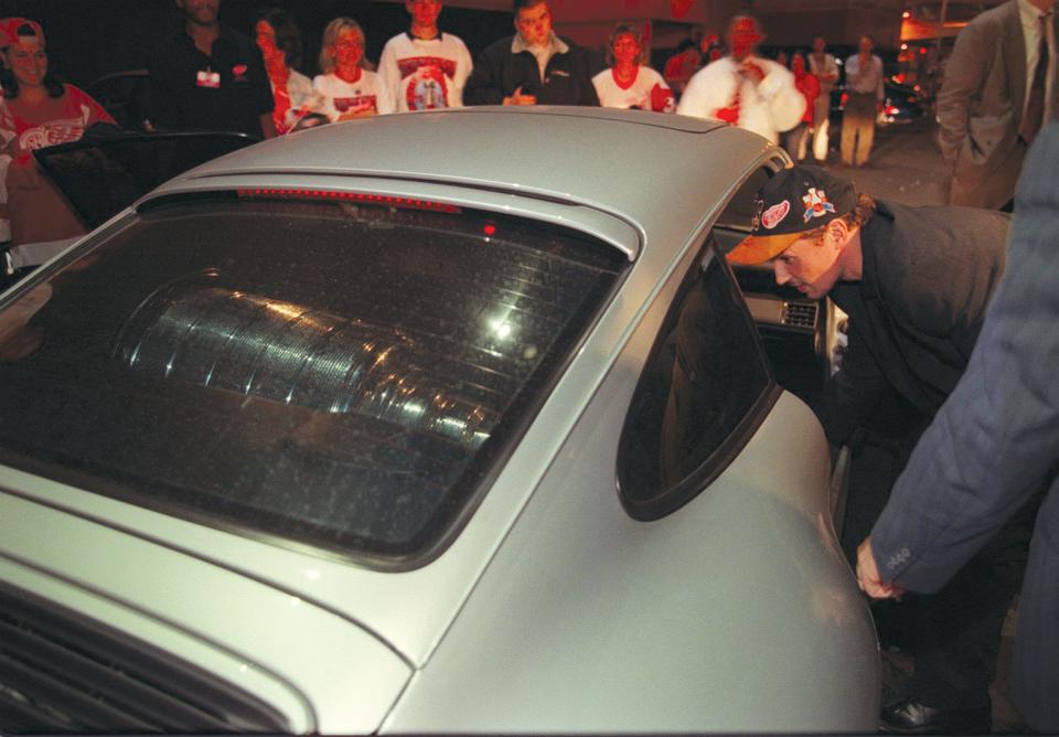 Despite the tight squeeze, Steve Yzerman nestled the Stanley Cup into the back of his silver Porsche before exiting The Joe in the wee hours.