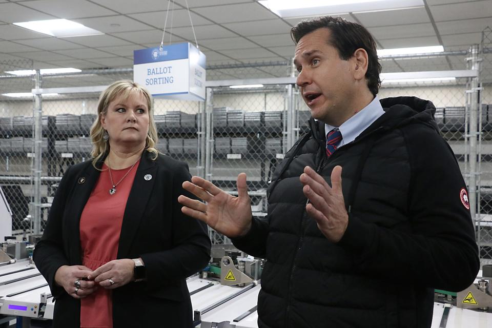 Interim Registrar of Voters Cari-Ann Burgess, left, and Nevada Secretary of State Cisco Aguilar speak with the media and concerned citizens at the Washoe County elections facility in Reno on Jan. 23.