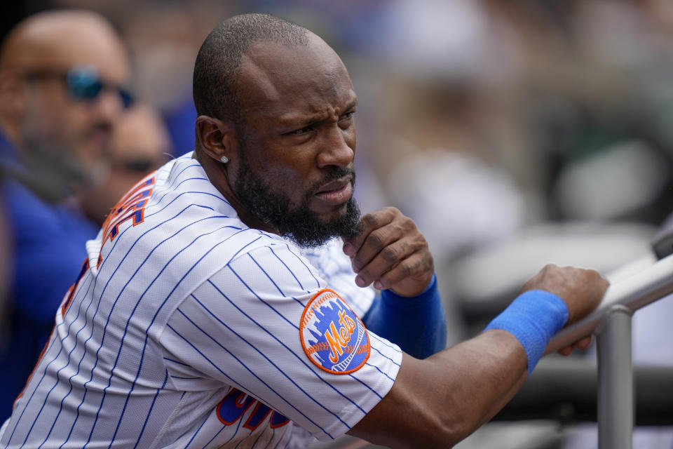 New York Mets' Starling Marte reacts in the dugout after being picked off by Cleveland Guardians starting pitcher Tanner Bibee (61) at first in the fourth inning of the opener of a split doubleheader baseball game, Sunday, May 21, 2023, in New York. (AP Photo/John Minchillo)