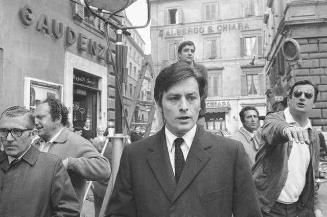 Black and white 1969 photo of Alain Delon on set