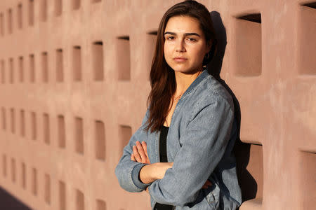 Former Biological Resource Center intern Emily Glynn, 24, poses for a portrait at the Arizona State University Art Museum in Tempe, Arizona, U.S., December 17, 2017. Picture taken December 17, 2017. REUTERS/Caitlin O'Hara