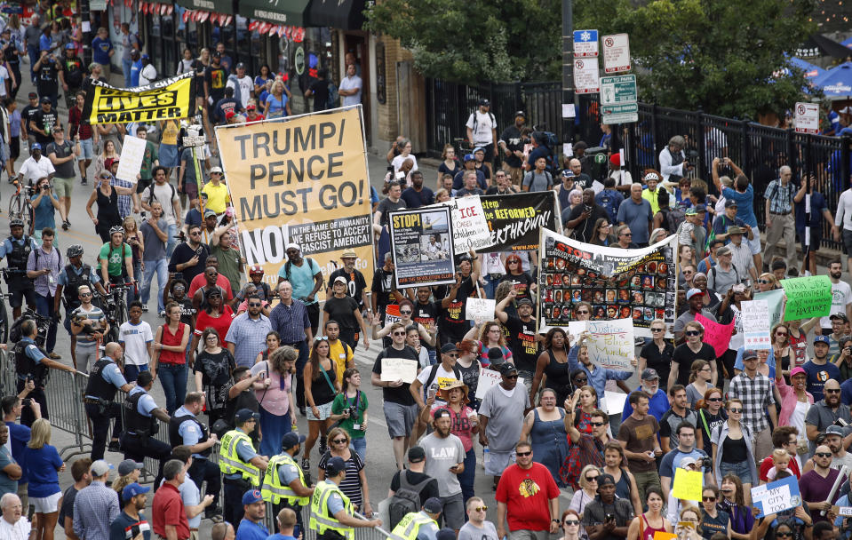 Protesters arrive at the Wrigley Field to demand more government action against gun violence, Thursday, Aug. 2, 2018, in Chicago. (AP Photo/Kamil Krzaczynski)