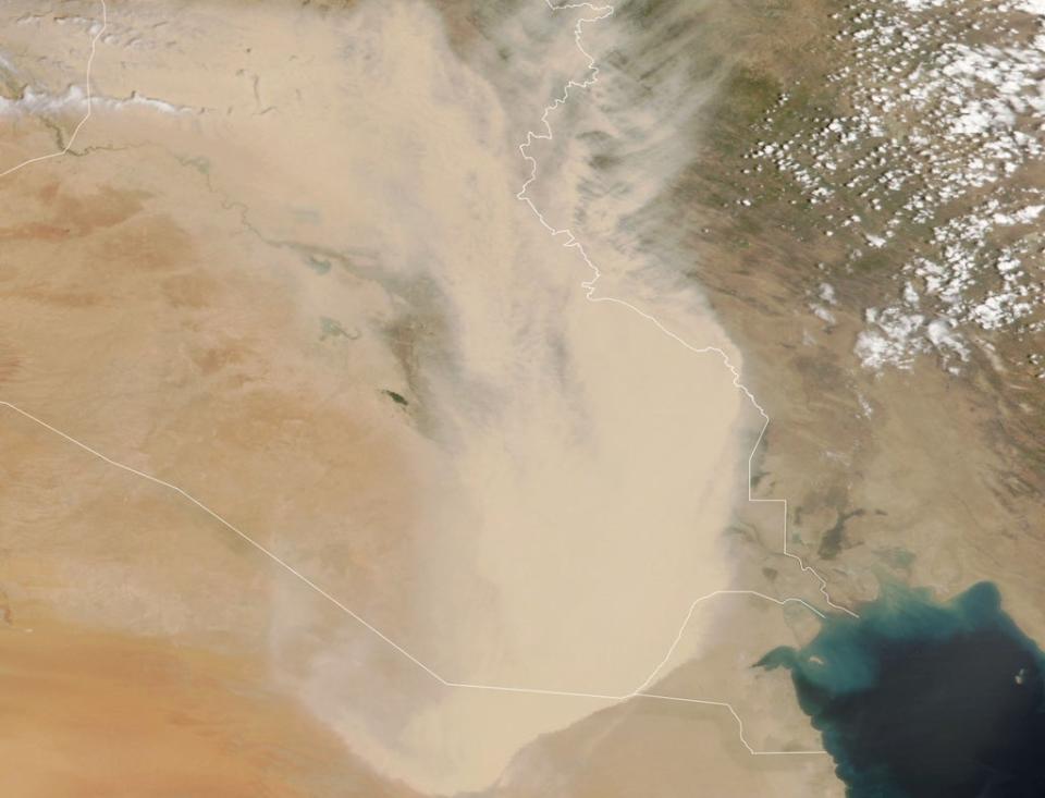 In this handout satellite image courtesy of NASA Earth Observatory taken on 16 May 2022, a dust storm engulfs parts of Iraq and neighbouring countries (AFP)