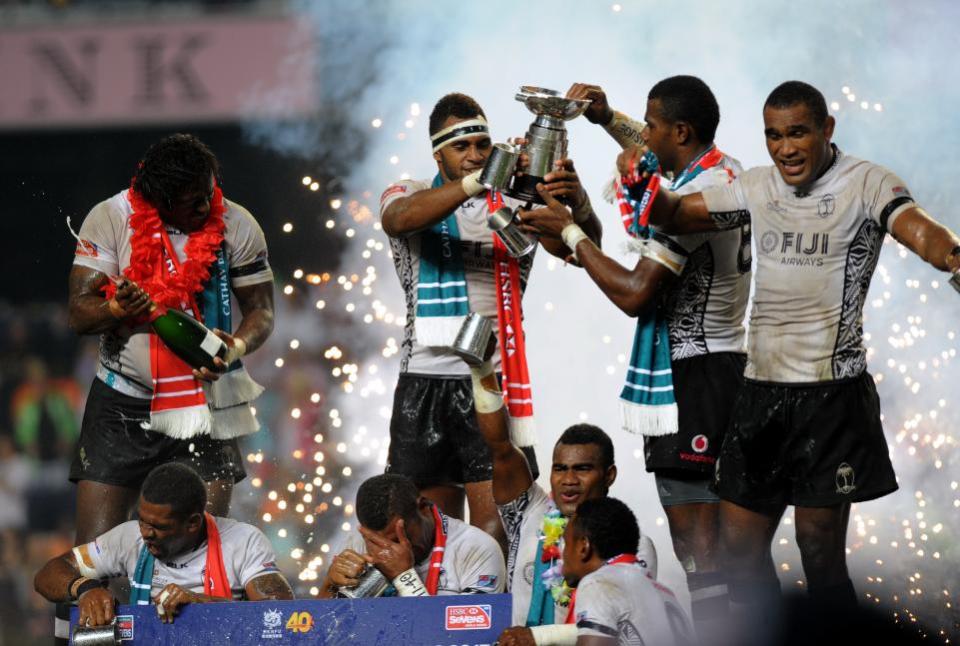 Rugby players of Fiji celebrate after defeating New Zealand