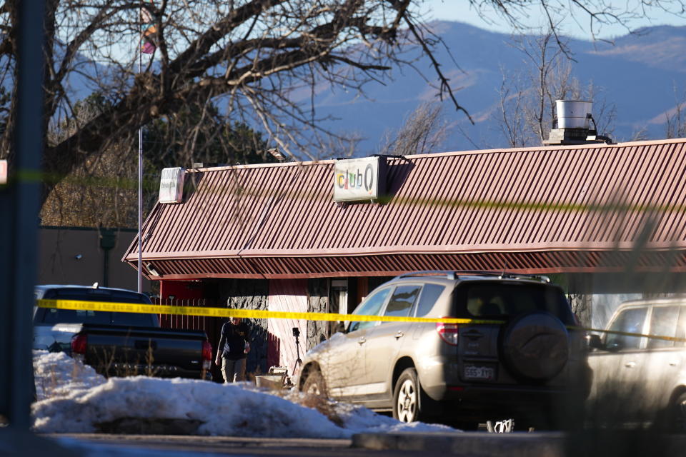 FILE - An FBI agent walks outside of Club Q, the site of a weekend mass shooting, Monday, Nov. 21, 2022, in Colorado Springs, Colo. For as long as LGBTQ folks have gathered in bars and nightclubs, such spaces have hosted weddings, birthed churches and been called “heavenly.” But November’s Club Q shooting was a grim reminder that even today gathering in queer clubs isn’t without risk. Amid a barrage of anti-LGTBQ legislation and hate crimes, many LGBTQ people of faith say it’s essential to protect the places they see as sacred. (AP Photo/Jack Dempsey, File)