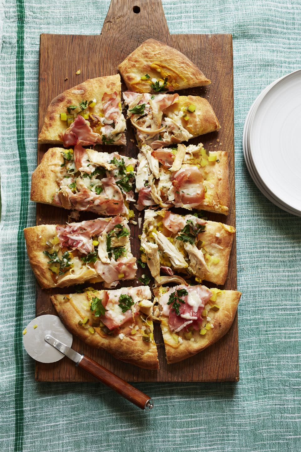 <p>Forget red sauce — deck out your pizza with yellow mustard, baked ham, Gruyère cheese, onions, and dill pickles.</p><p><a href="https://www.womansday.com/food-recipes/food-drinks/recipes/a56182/pizza-cubano-recipe/" rel="nofollow noopener" target="_blank" data-ylk="slk:Get the recipe for Pizza Cubano.;elm:context_link;itc:0;sec:content-canvas" class="link "><em>Get the recipe for Pizza Cubano.</em></a></p>