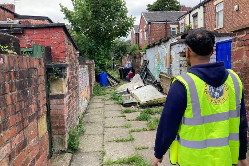 Councillor Kaleel Khan showing us issues of fly tipping in his ward of St Peters, Ashton