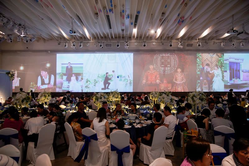 The Wider Image: Coronavirus dampens celebrations in China's wedding gown city