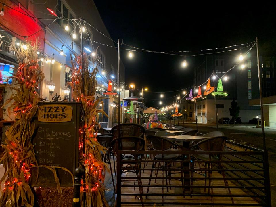 Izzy Hops, 2311 Murry Ave., has outdoor heaters surrounding tables on its decorated patio.