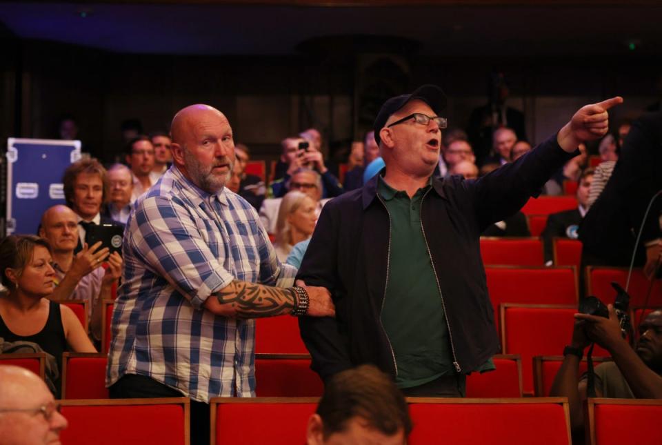 A heckler is removed by security after disrupting the Reform leader’s speech (Getty)