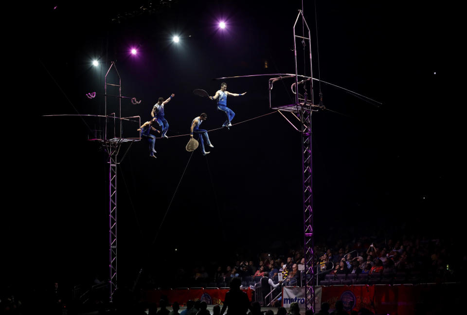 A Ringling Bros. and Barnum & Bailey high wire act performs Saturday, Jan. 14, 2017, in Orlando, Fla. The Ringling Bros. and Barnum & Bailey Circus will end the "The Greatest Show on Earth" in May, following a 146-year run of performances. Kenneth Feld, the chairman and CEO of Feld Entertainment, which owns the circus, told The Associated Press, declining attendance combined with high operating costs are among the reasons for closing. (AP Photo/Chris O'Meara)