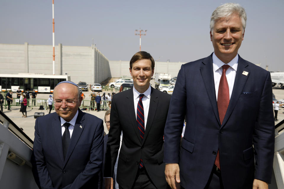 Israeli National Security Advisor Meir Ben-Shabbat, left, U.S. President Donald Trump's senior adviser Jared Kushner, center, and U.S. National Security Advisor Robert O'Brien, right, board the Israeli flag carrier El Al's airliner as they fly to Abu Dhabi for talks meant to put final touches on the normalization deal between the United Arab Emirates and Israel, at Ben-Gurion International Airport, near Tel Aviv, Israel Monday, Aug. 31, 2020. (Nir Elias/Pool Photo via AP)