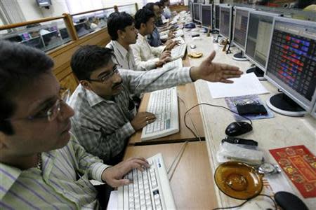 Stock brokers engage in trading at a brokerage firm in Mumbai February 14, 2008. REUTERS/Arko Datta/Files