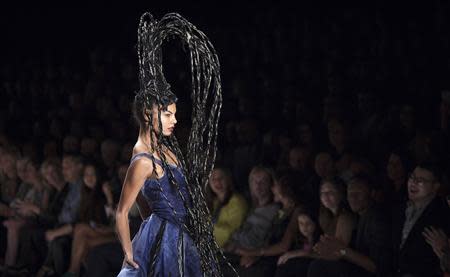 A model presents a creation during the Project Runway Spring 2014 collection show at New York Fashion Week September 6, 2013. REUTERS/Carlo Allegri