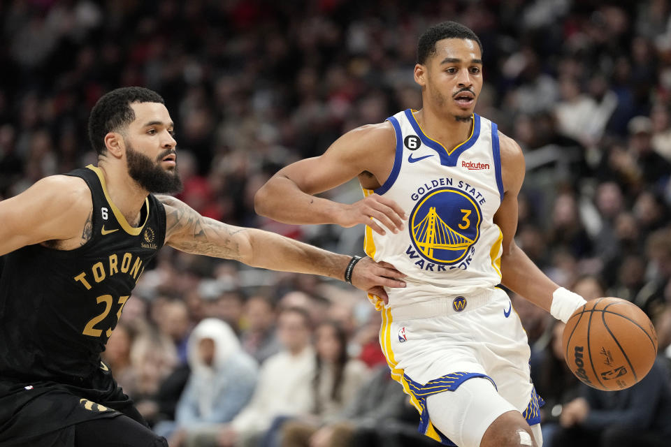 Toronto Raptors guard Fred VanVleet (23) puts pressure on Golden State Warriors guard Jordan Poole (3) during second-half NBA basketball game action in Toronto, Sunday, Dec. 18, 2022. (Frank Gunn/The Canadian Press via AP)