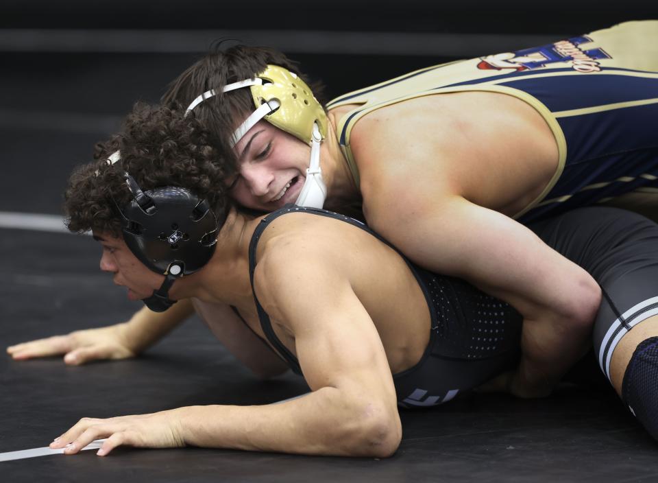 Herriman’s Ty Carman wrestles Westlake’s Kaizen Detoles in the 6A Wrestling State Championships at the UCCU Center in Orem on Friday, Feb. 16, 2024. | Laura Seitz, Deseret News