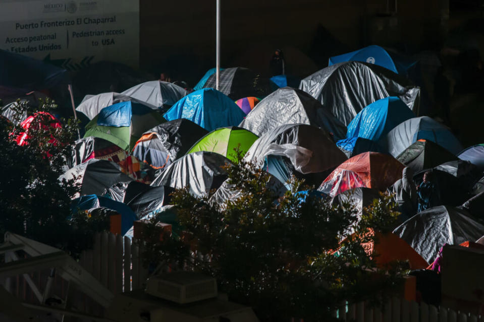 An improvised housing camp in Tijuana, Mexico, for Central American migrants waiting for the U.S. authorities to allow them to enter to begin their process of asylum. Some migrants have been tricked into getting on buses to New York and Washington, lawyer Ari Sawyer says. (Photo by Francisco Vega/Getty Images)