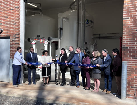 Aqua New Jersey President Natalie Chesko and other company leaders are joined by Lawrence Township Mayor Patricia Hendricks Farmer and representatives from the New Jersey Department of Environmental Protection to cut the ribbon on a new PFAS treatment facility in Lawrence Township.(Photo: Business Wire)