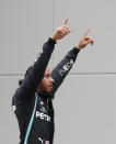 Mercedes driver Lewis Hamilton of Britain celebrates after winning the Turkish Formula One Grand Prix at the Istanbul Park circuit racetrack in Istanbul, Sunday, Nov. 15, 2020. (Murad Sezer/Pool via AP)