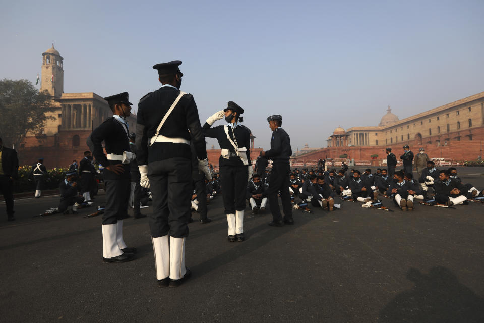 An officer of the Indian Air Force marching contingent practices her salute during rehearsals for the upcoming Republic Day parade in New Delhi, India, Thursday, Jan. 21, 2021. Republic Day marks the anniversary of the adoption of the country's constitution on Jan. 26, 1950. Thousands congregate on Rajpath, a ceremonial boulevard in New Delhi, to watch a flamboyant display of the country’s military power and cultural diversity. (AP Photo/Manish Swarup)