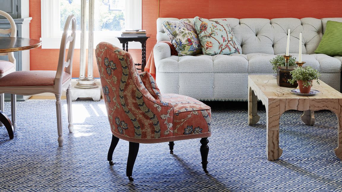 living room sikes connected the living and dining rooms into one large space to accommodate entertaining wallpaper phillip jeffries with samuel  sons trim sofa fabric raoul textiles drapery quadrille sconce valley drapery plinth allison caccoma decoration rug vermilion