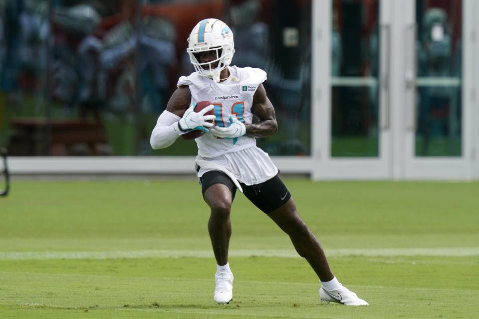 Miami Dolphins wide receiver DeVante Parker (11) grabs a pass during an NFL football practice, Monday, Aug. 2, 2021, in Miami Gardens, Fla. (AP Photo/Marta Lavandier)