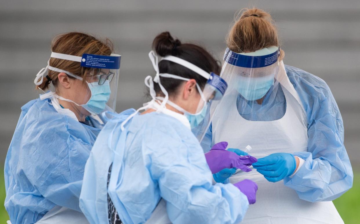 NHS staff carry out coronavirus tests in Lincoln  - Joe Giddens/PA