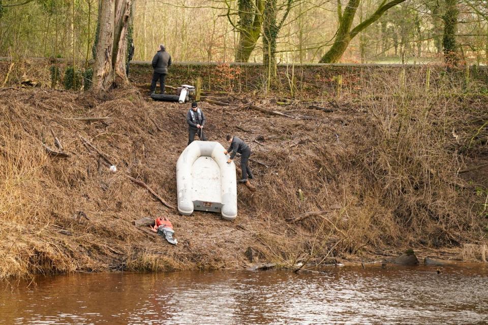 Police search teams by the River Wyre in St Michael's on Wyre, Lancashire, as police continue their search for missing woman Nicola Bulley (PA)