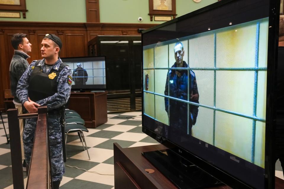 Russian opposition leader Alexei Navalny appears on a screen set up at a court room of the Moscow City Court via a video link from his prison colony provided by the Russian Federal Penitentiary Service during a hearing of an appeal against his nine-year prison sentence in Moscow, Russia, Tuesday, May 24, 2022. A Russian court has rejected Navalny’s appeal of a nine-year prison sentence for fraud. The Tuesday rejection means Navalny will be sent to a strict-regime prison, according to the independent news site Mediazona. (AP Photo/Alexander Zemlianichenko)