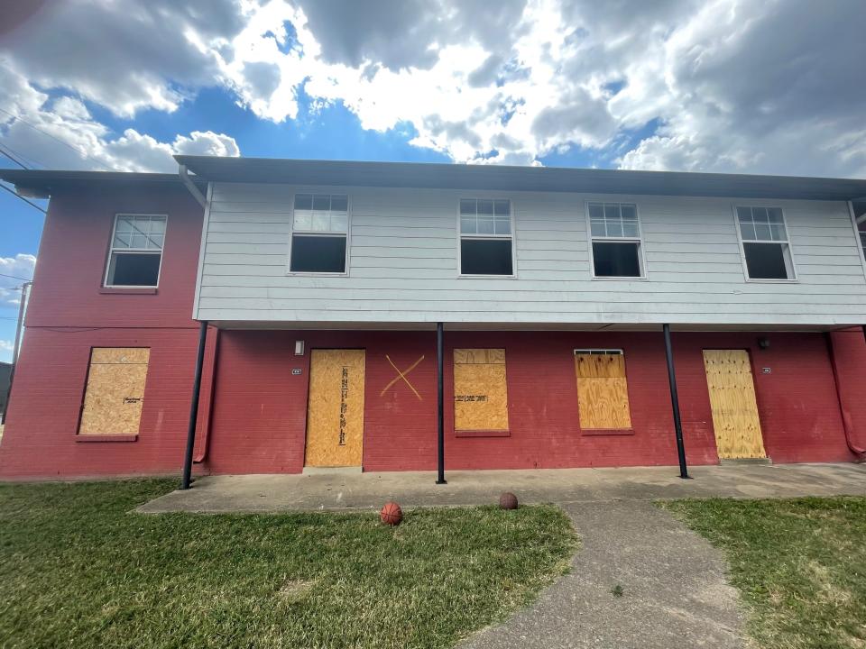 The windows and doors of several units in the RiverChase apartment complex were boarded up as of June 30, 2022.