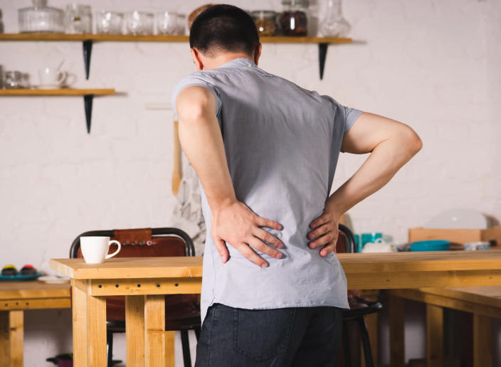 Man suffering from back pain and kidney stones
