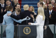 <p>President Donald Trump hugs his family after taking the oath of office during the 58th Presidential Inauguration at the U.S. Capitol in Washington, Friday, Jan. 20, 2017. (Photo: Patrick Semansky/AP) </p>