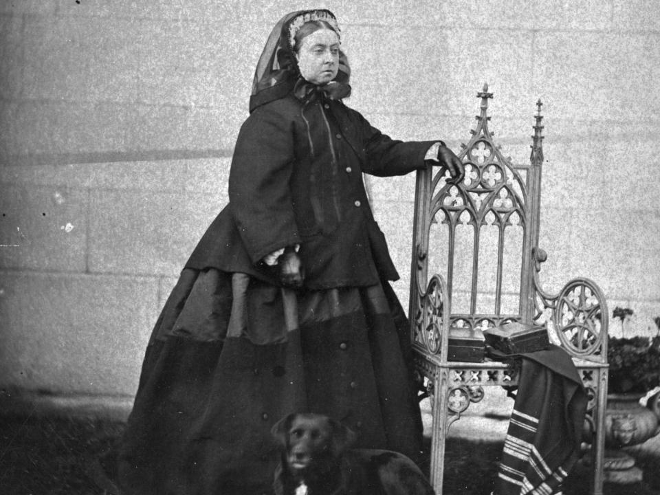 Queen Victoria posing for a photograph in London while wearing black.