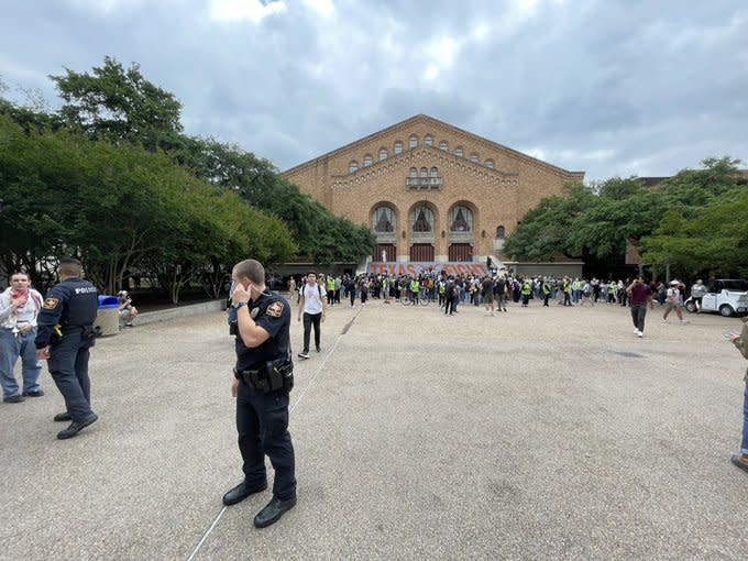 Protesters start gathering on campus in support of Gaza. University Police and Department of Public Safety Troopers begin walling off protesters’ intended gathering area, not letting others in. April 24, 2024. (KXAN Photo/Ryan Chandler)