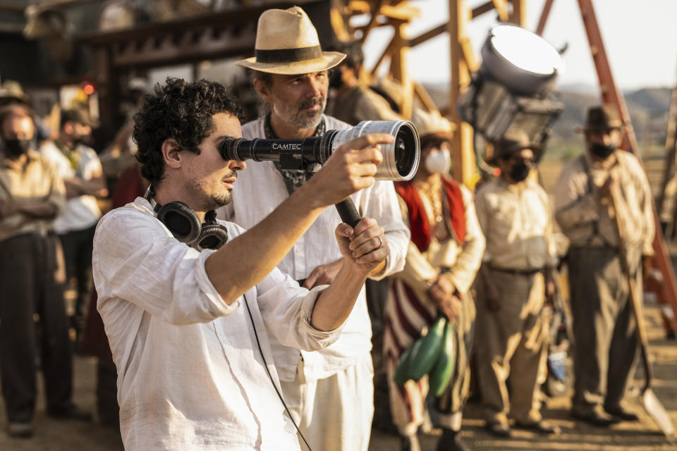 This image released by Paramount Pictures shows director Damien Chazelle, left, and director of photography Linus Sandgren on the set of "Babylon." (Scott Garfield/Paramount Pictures via AP)